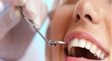 Dentist examining a patient's teeth during a check-up
